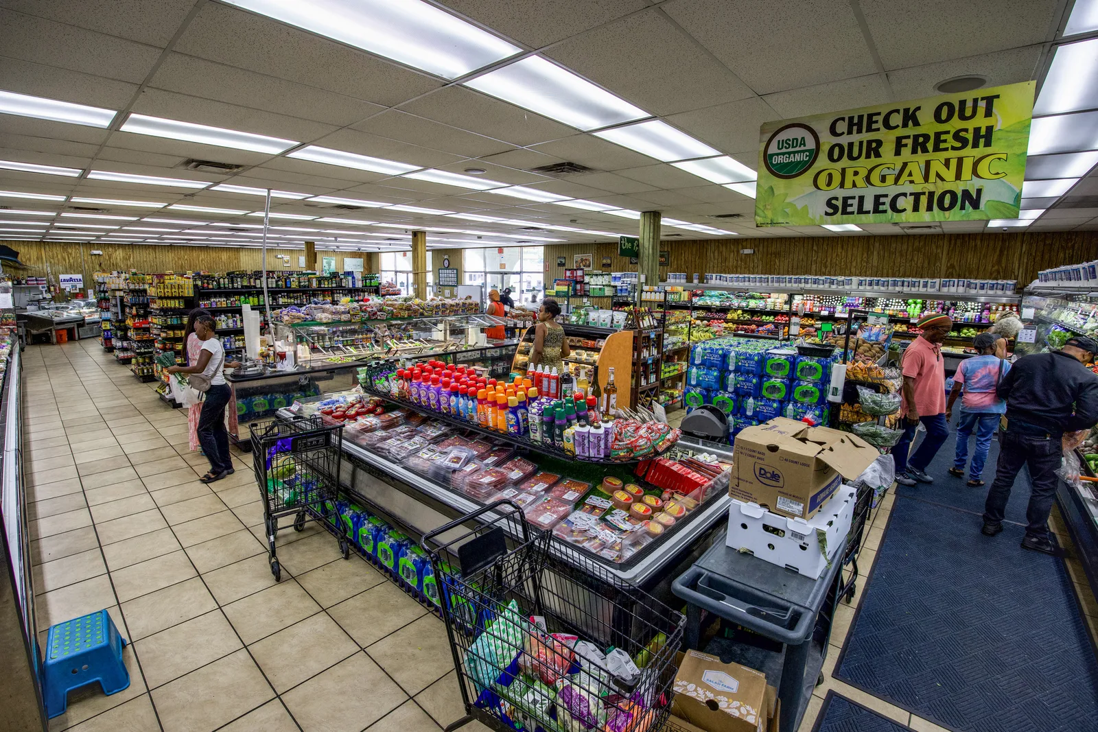 Wide view across the market and produce displays at The Fruit Bowl.