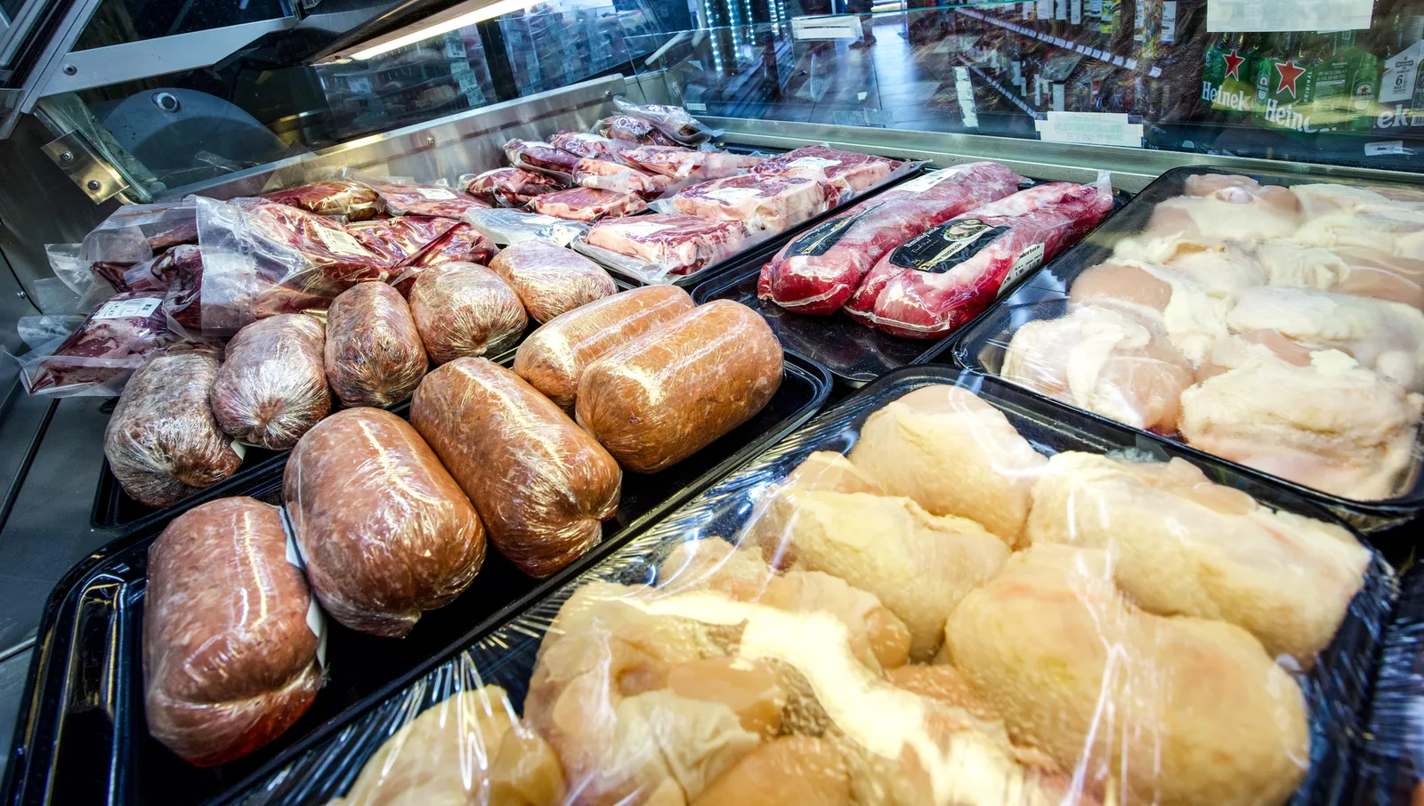Meat selection in a refrigerated counter at The Fruit Bowl.