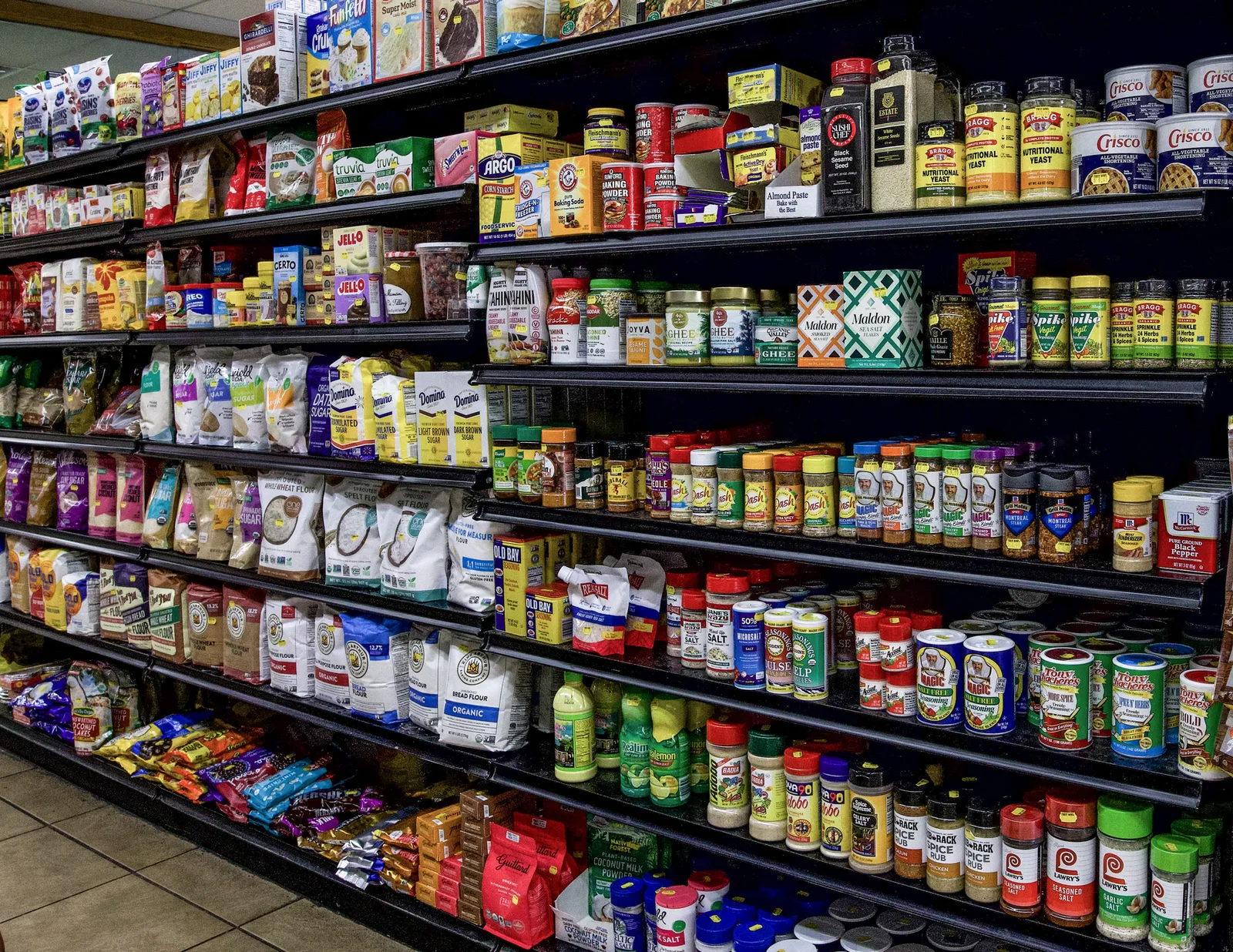 Specialty pantry items on grocery shelves at The Fruit Bowl.
